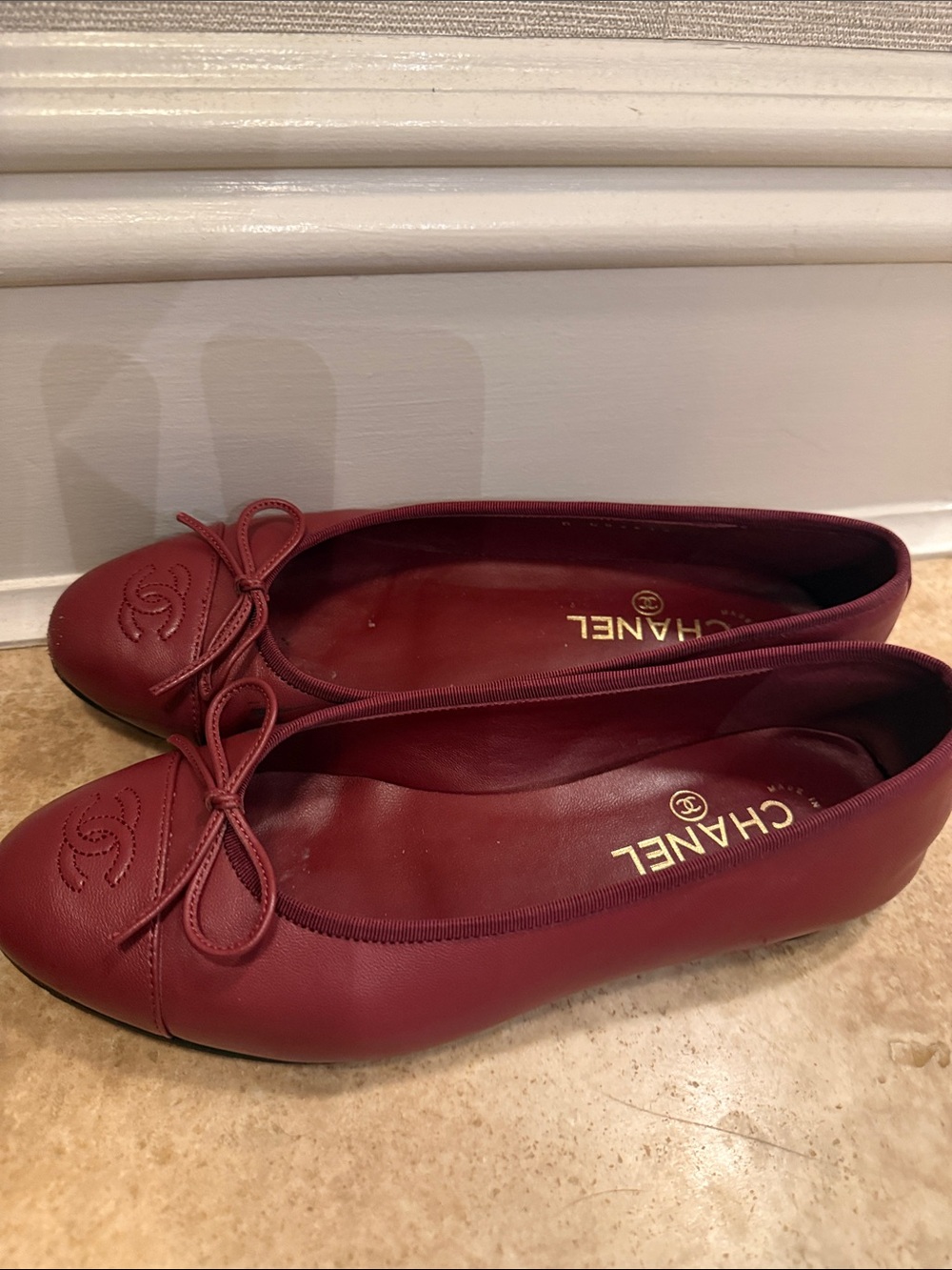 CHANEL Burgundy Leather Ballet Flats with Bow Accent